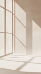 Obraz premium Sunlit room with window shadows creating abstract patterns on the wall and floor; symbolizing minimalism and clean design, ideal for interior design and architectural themes.
