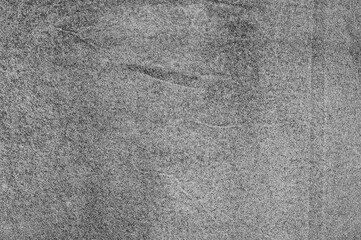 Gray suede leather macro photo as background.