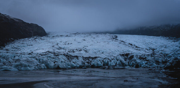 Moody Arctic Landscape with a Glacier and Fog