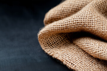 Closeup Of Burlap Fabric On Dark Surface
