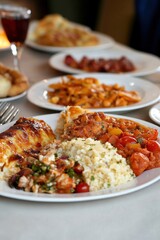 Naklejka premium Delicious mediterranean cuisine with roasted vegetables and couscous on a table