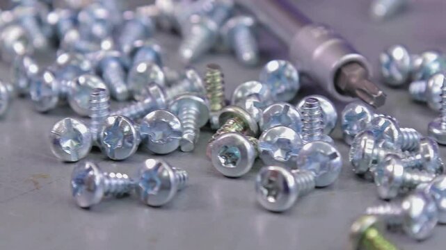 Metal screws for fastening equipment. Soft focus. Close-up. 