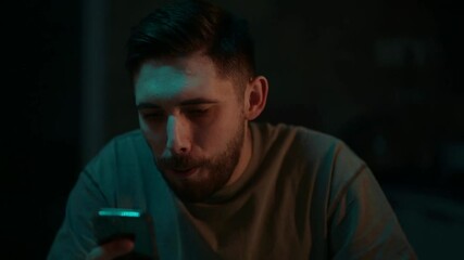 Enjoying a late-night snack while scrolling through a phone to seize the moment of comfort