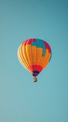 Fototapeta premium Colorful Hot Air Balloon Soaring High In The Sky