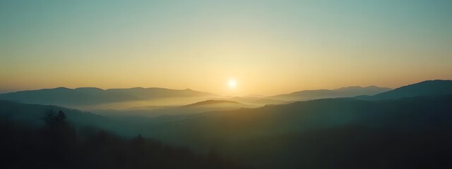 Obraz premium A panoramic view of the alpine mountains at sunrise 