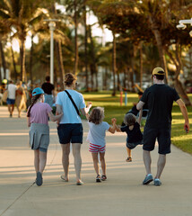 family walking in park Miami Beach summer vacation 