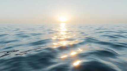 Ocean waves gently rolling under a hazy sky at dawn along a tranquil coastline