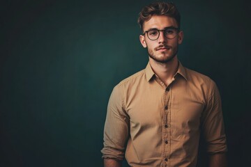 Obraz premium Stylish Young Man in Casual Attire Posing Against a Dark Background