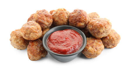 Pile of delicious meatballs and bowl with ketchup isolated on white