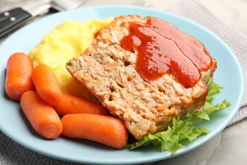 Delicious baked turkey meatloaf with mashed potato served on table, closeup