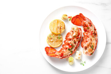 Delicious lobster tails with lemon, microgreens and green onion on white table, top view. Space for text