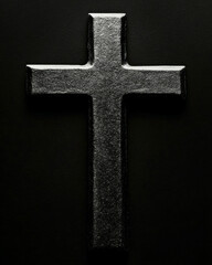Dramatic close-up of a cross silhouette with high contrast lighting in a minimalist setting