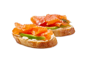 Tasty canapes with salmon, avocado and cream cheese isolated on white