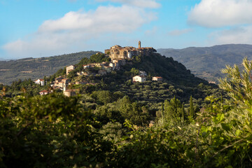 Obraz premium Picturesque hilltop tuscany village Montegiovi with ancient stone buildings among lush olive groves showcasing rural Italian charm medieval architecture panoramic landscapes ideal for travel lovers 