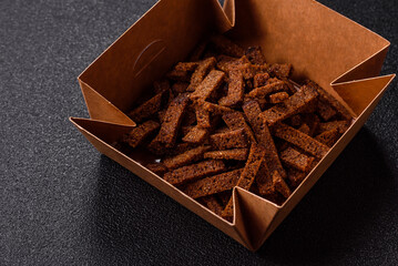 Crispy homemade brown bread crackers or croutons with seeds and grains