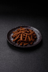 Crispy homemade brown bread crackers or croutons with seeds and grains