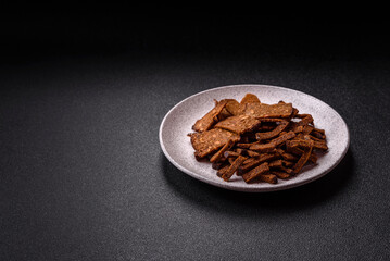 Crispy homemade brown bread crackers or croutons with seeds and grains