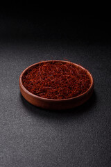 Red thin hot chili threads on a dark background