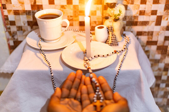 Offering for old black man, Umbanda Afro-Brazilian religion, Ax&eacute;, Orix&aacute;, Sarav&aacute;! The Umbanda ritual. Umbanda sculpture object. Candle, light, religion, African. Rio de Janeiro, Brazil.