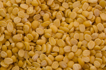 Neatly arranged yellow split peas highlighting their texture and color