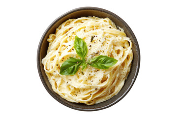 Creamy fettuccine alfredo in a dark bowl with basil