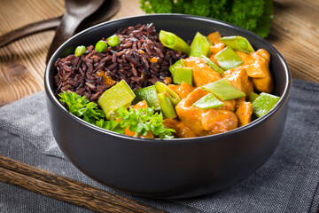 Thai red curry with chicken and black rice.