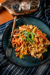 Fried chicken pieces with vegetables.