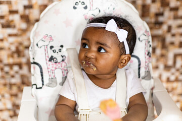 Spontaneous reaction of a child when introduced to food, eating for the first time. Rio de Janeiro,...