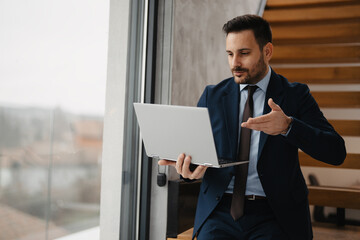 Business manager working on his laptop