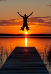 Fototapeta premium Person Jumping Off Dock into Sunset Over Calm Lake Water Reflection