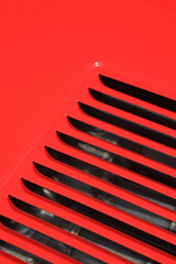 coche deportivo clásico rojo carrocería de rejilla con textura abstracta 4M0A9134-as25