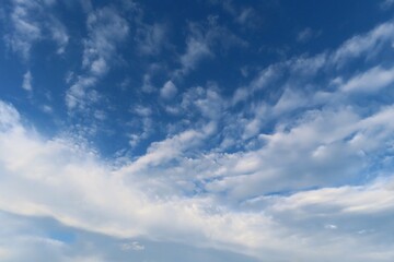 Obraz premium Beautiful cloudscape in blue sky, natural clouds background 