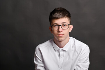 boy with glasses on a gray background. mock up