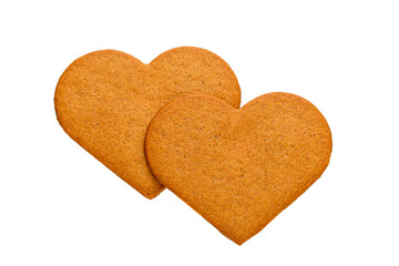 Gingerbread cookies in the shape of 2 hearts. Isolated on white background.