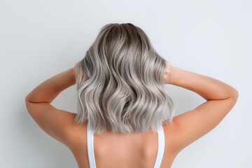 Fototapeta premium Silver wavy hairstyle, shoulder-length soft waves, bold and radiant hair color, modern and stylish haircut, elegant and chic beauty trends, professional look, isolated on white background