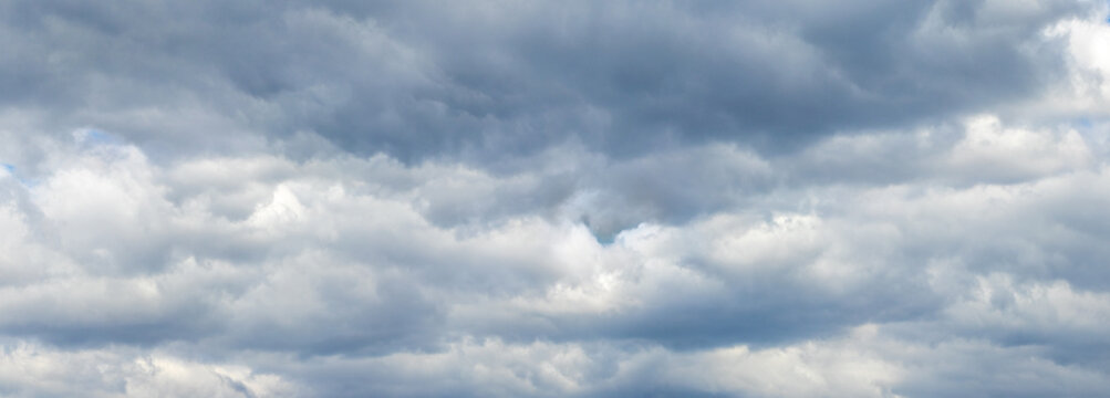rainy sky covered with solid gray clouds