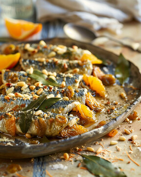 Traditional Sicilian sarde a beccafico, stuffed sardines with breadcrumbs, pine nuts, raisins, and citrus zest.