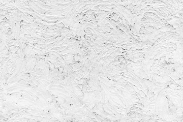 Grungy white concrete wall with stucco relief, seamless texture
