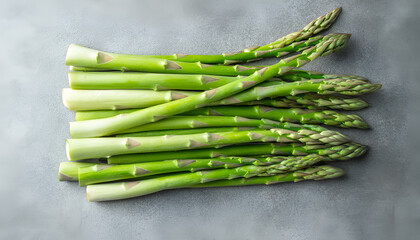 Pile of fresh white asparagus on grey table, closeup