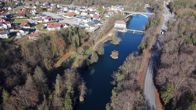 Aerial footage of the Cross of the Traun on a small islet on Traun River in Austria