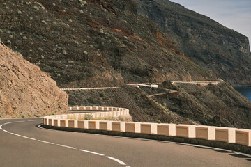 Stunning coastal road winding through dramatic volcanic landscape.  Perfect for travel, adventure,...