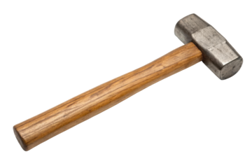 Heavy hammer on a wooden surface for crafting, cut out