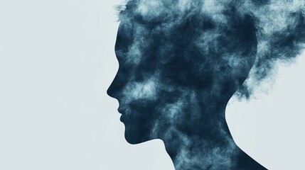 Abstract silhouette of woman in smoke art with ethereal blue mist effect