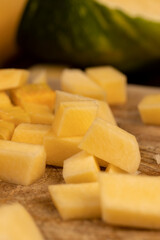 diced soft ripe pumpkin of orange color, fresh pumpkin for cooking