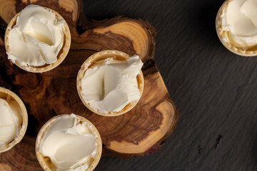 waffle cups with buttercream during dessert cooking