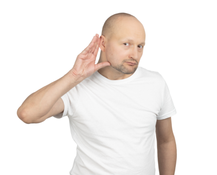 Curious bald man listening attentively with a hand to his ear