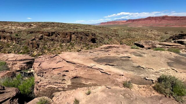 Dramatic rock formations and rugged desert terrain create stunning natural landscape at Utah's Sand Hollow State Park.