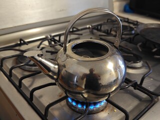 metal teapot heating water for herbal tea, UGC teapot concept