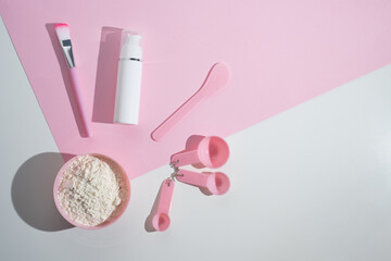 Cosmetic clay - face and body skin care - on white background. Spa concept
