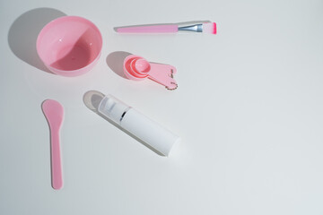 Cosmetic clay - face and body skin care - on white background. Spa concept
